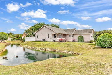 View of front of property featuring a shingled roo