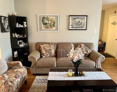 Living room with hardwood / wood-style flooring