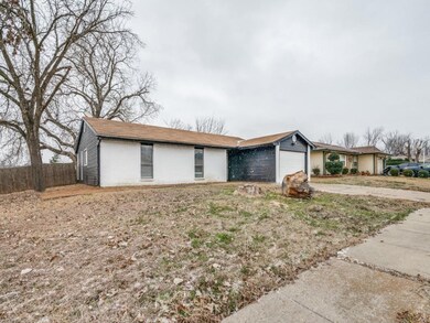 Single story home featuring driveway, an attached 