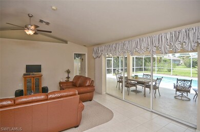 Living area features high ceilings & all tile floors thru out and over-sized pocketed sliders