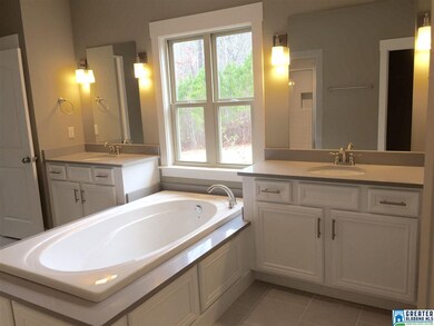 The Master Bath Suite features quartz countertops,