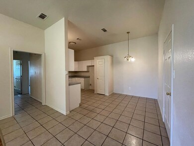 Kitchen featuring kitchen peninsula, decorative li