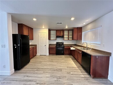 Kitchen with visible vents, under cabinet range ho