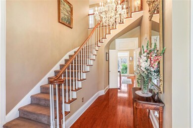 Curved staircase with Chrystal Chandelier