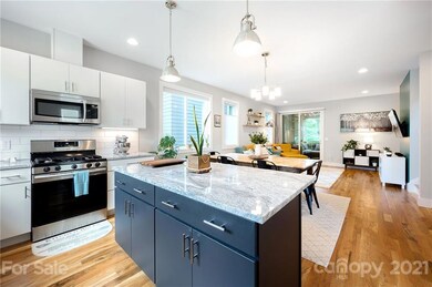 Breakfast bar in kitchen opens to dining area
