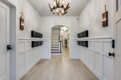 Entryway Foyer with Antler Chandelier and Mailroom