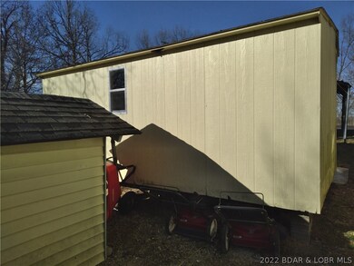 Well house/storage shed for lawn equipment