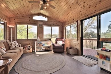 4 season porch with vaulted tongue-in-groove cedat ceiling.