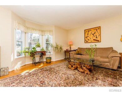 FAMILY ROOM W/ HARDWOOD FLOORS & BAY WINDOW