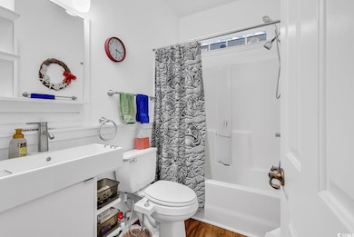 Full bathroom featuring shower / tub combo with cu