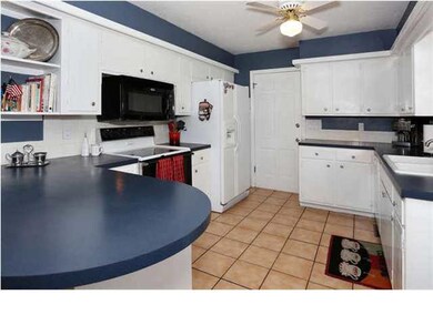 Neutral tiled floors and ample counter space!