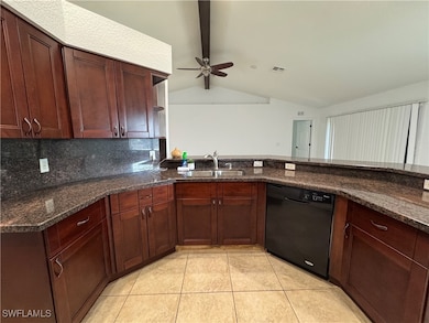 Kitchen with black dishwasher, visible vents, loft