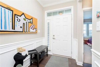 Entryway with plenty of natural light through the transom windows.