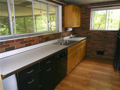 Kitchen with windows that open to exerior deck