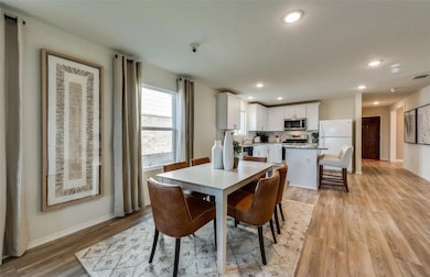 Dining area featuring recessed lighting and light wood-style floors
