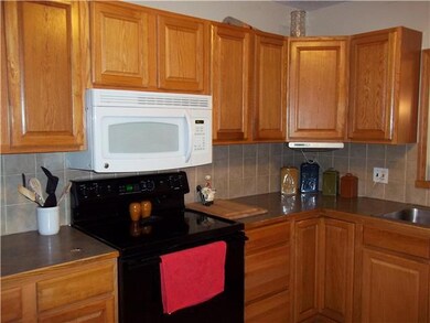 Updated kitchen with new stove and tile floors.  L