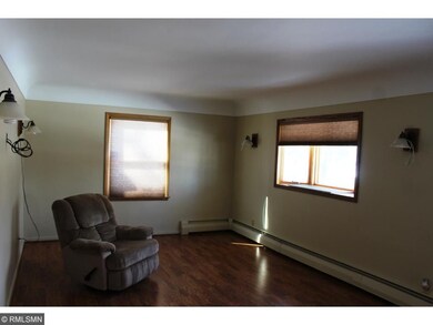 Living room with new flooring and paint.