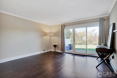 The Living Room Sliders over look a pond and matur