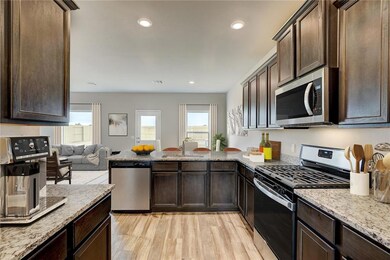 The open-concept kitchen overlooking the entertain