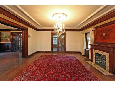 Living room opening to dining room and sunroom.