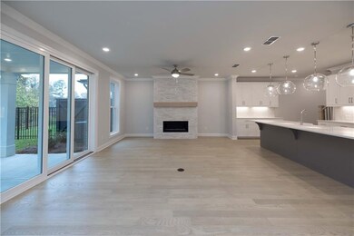 A fireplace highlights the living space. *Please note the photos shown are representative of the plan but are not of the actual home.