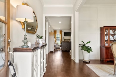 Front entrance into this beautiful home with hardw