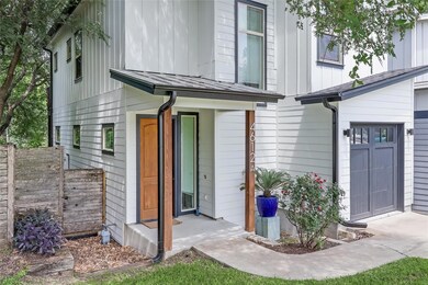 View of front of house with fence and board and b