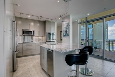 The lovely kitchen features an expanded island wit