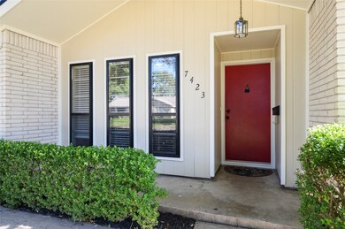 Light painted exterior combines perfectly with the black outlined windows and popping red front door to create eye catching curb appeal!