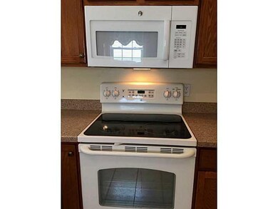 Kitchen. Gas hookup is behind this electric stove 