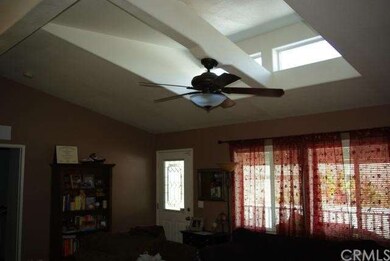 Skylight in living room and ceiling fan