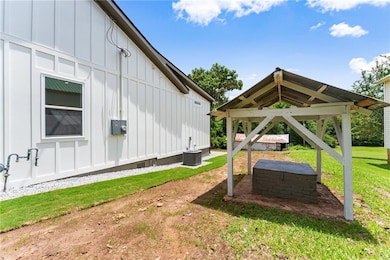 View of grassy yard with a gazebo