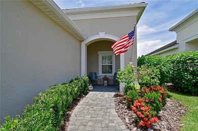 The paver walkway leads to the covered front porch