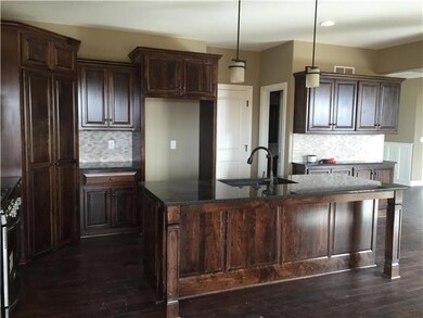 Upgrade Shown: Gas Range, Mosaic Tile Backsplash, 
