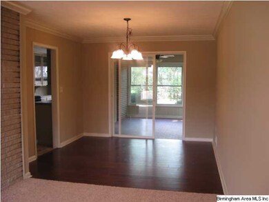 Dining room joins living room, kitchen and sunroom