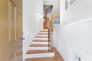 Stairs with a decorative wall, a wainscoted wall, 
