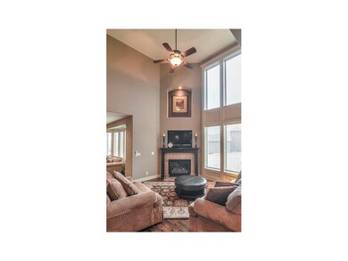 Large hearth room with vaulted ceilings and wood f