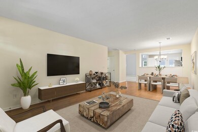 Living room featuring a notable chandelier and har