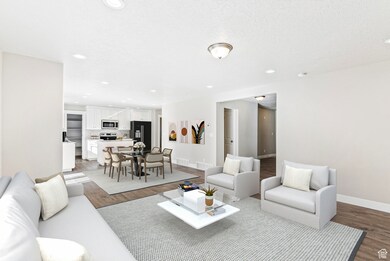 Living area with wood finished floors and recessed lighting