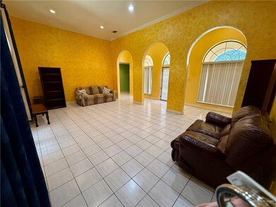 Living Room with arched walkways, light tile patterned floors, a towering ceiling, and crown molding
