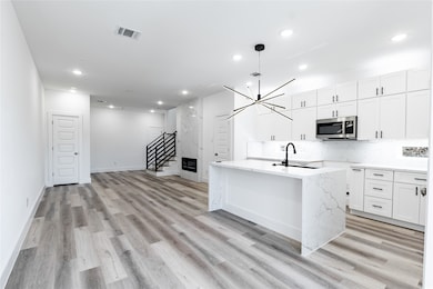 Open concept floor plan featuring high celings wit