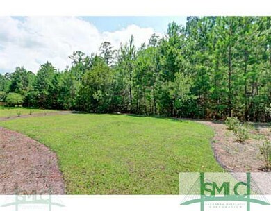 Exterior Back. Tree lined backyard