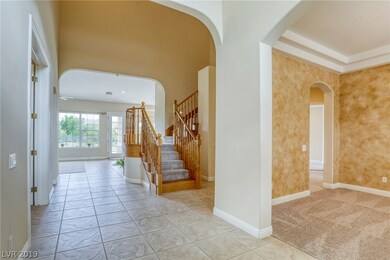entry with dramatic vaulted ceilings and double st