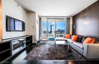 Living room with dark wood-style floors, a city vi