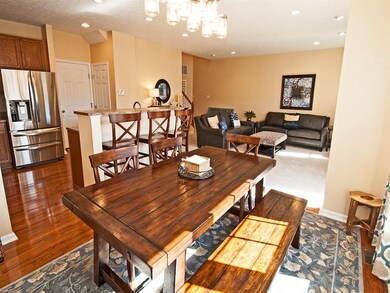 SPACIOUS DINING AREA WITH HARDWOOD FLOORING AND OP
