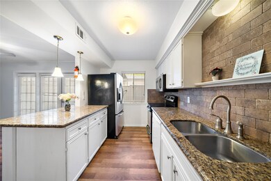 Granite counter tops, tile backsplash, and stainle