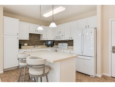 Stunning kitchen with Corian counters and integrat