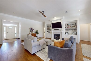 Living room with hardwood / wood-style floors, a c