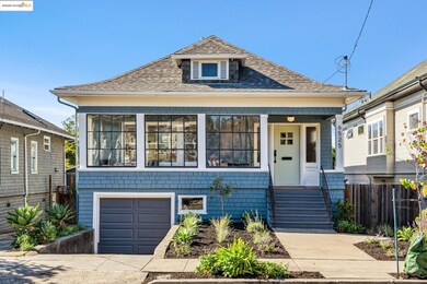 View of front of home featuring roof with shingles, covered porch, a garage, and concrete driveway
