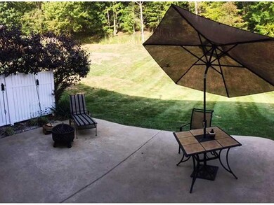 Patio/Deck. Concrete patio with woods behind for p